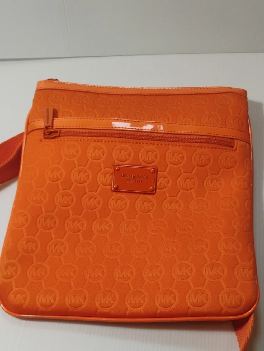 Michael Kors Neoprene Tangerine Mono Embossed Swing Crossbody bag